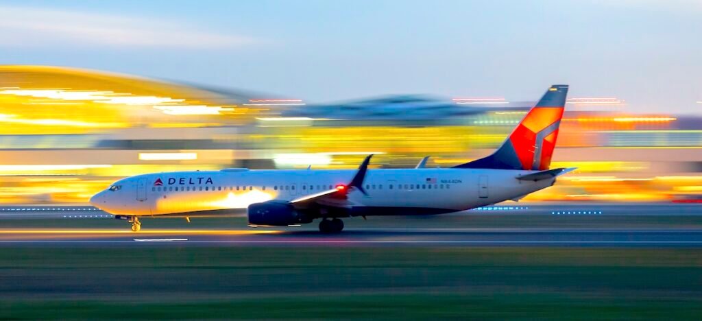 Delta Airlines 737 rolls down runway 10L for takeoff at Portland International Airport.