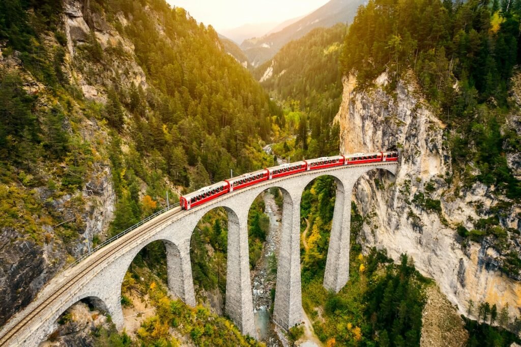Train crossing, euro rail, Landwasser Viaduct on raethian railway in Filisur – Albula, Graubunden, Switzerland The Landwasser Viaduct is a single track limestone railway viaduct near Filisur in the canton of Graubünden, Switzerland.