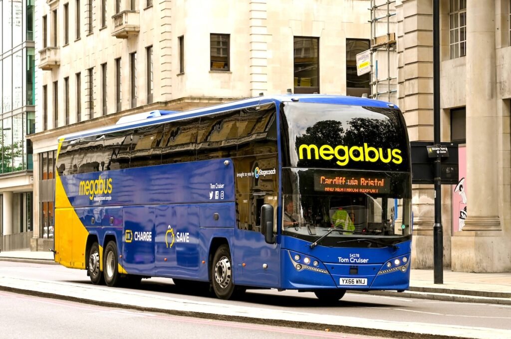 Megabus coach traveling on the highway, offering affordable and convenient long-distance bus travel.