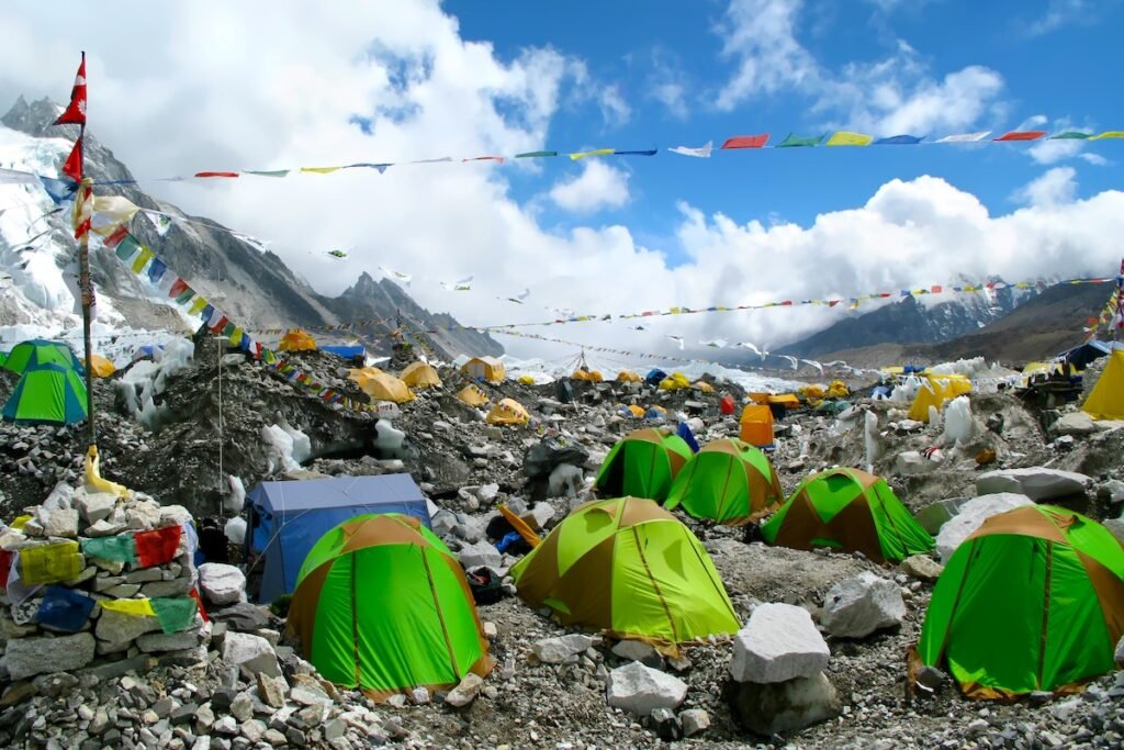 Colorful tents and Tibetan prayer flags at Everest Base Camp, Khumbu Region, Nepal.