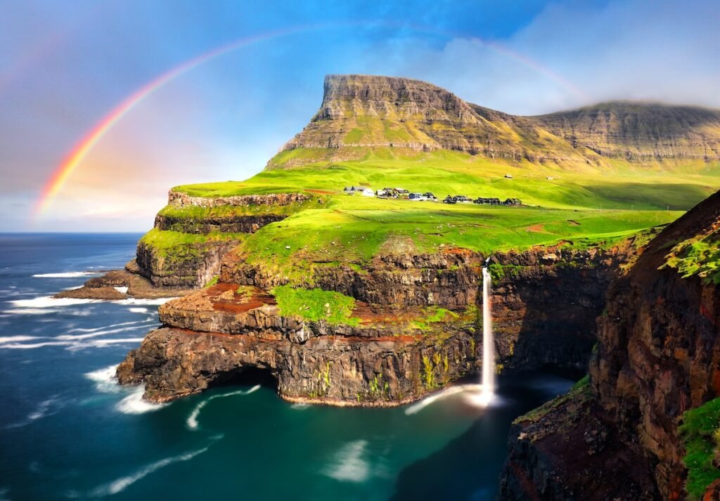 Faroe island landscape - waterfall with rainbow, Denmark, Unveil Europe ’s Secrets: Best Travel Destinations to Visit in 2025