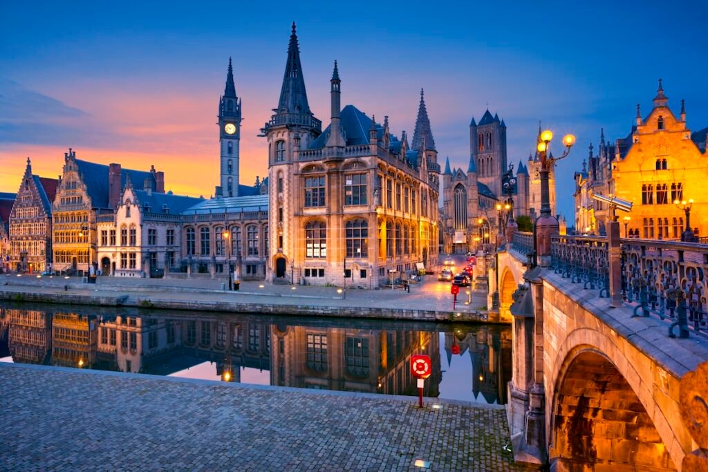 Image of Ghent, Belgium during twilight blue hour. Charming & Timeless: Best European Destinations for Your Next Great Escape
