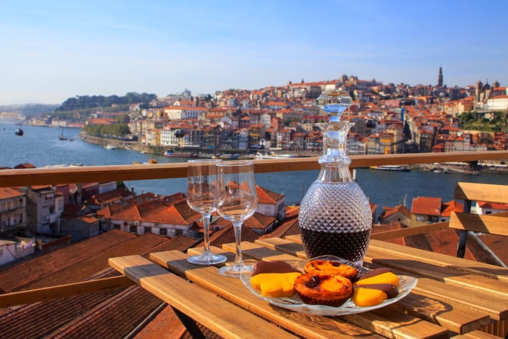Table with view a wonderful view over the river in Porto, Portugal. Charming & Timeless: Best European Destinations for Your Next Great Escape