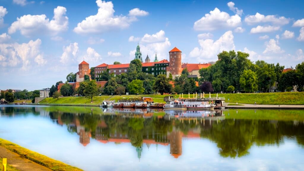 The river Vistula under the Royal Castle on Wawel Hill in the city of Krakow in Poland. Wawel Royal Castle is inscribed on the UNESCO World Heritage