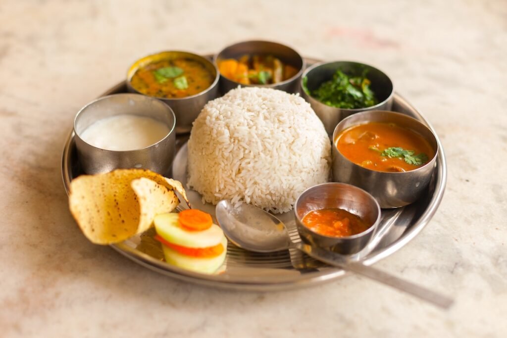 Vegetarian Nepali Thali (Dal Bhat) set, a traditional meal with rice and pulses in Nepal Top 10 Cheap Places To Travel Now: Explore The World On A Budget #Part 2