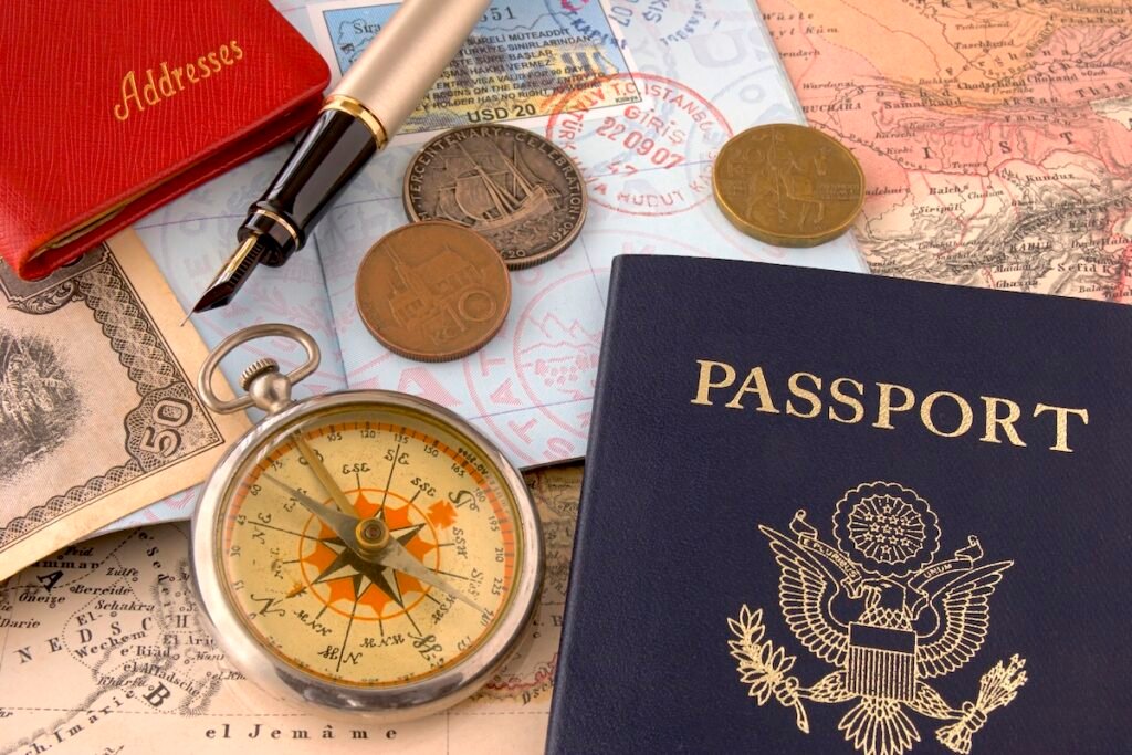 Photograph of a group of travel related items against a 130 year old map..