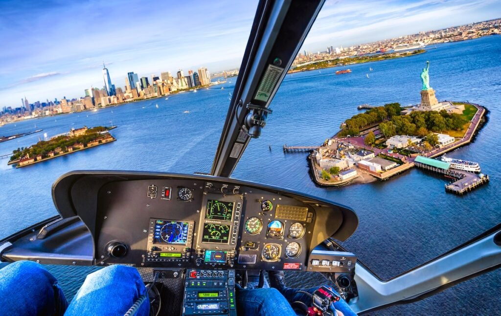 Cockpit view of a flight over Statue of Liberty in Liberty Island, New York. USA Luxury in the Heart: Best Central City Escapes for 2025