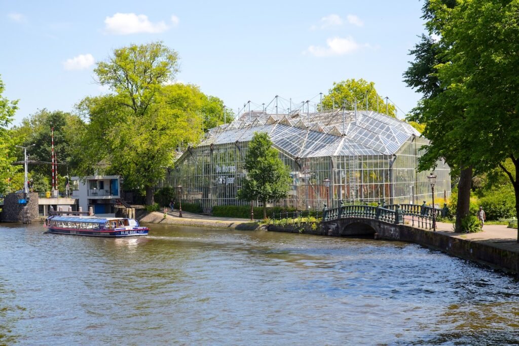 Amsterdam, The Netherlands, June 2020. View of the glasshouses of the Botanical garden (Hortus Botanicus), seen from the Jonas Daniel Meijerplein, Plantage, Amsterdam, Netherlands