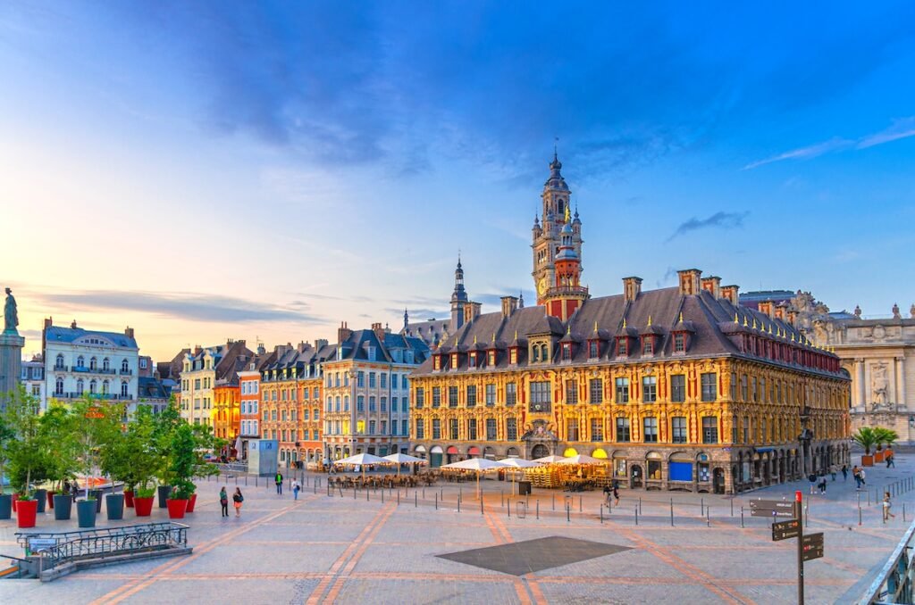 Lille cityscape, La Grand Place square in city center, historical monument Flemish mannerist architecture style buildings, Old Stock Exchange and bell tower Chamber of Commerce, Northern France Eurostar Destinations That Make the Ultimate Romantic Getaway in 2025