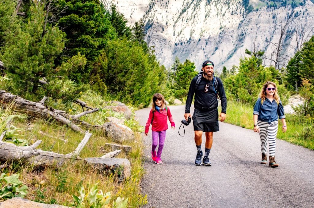 dad hiking daughters yellowstone national park trail Travelocity Ticket,Travelocity