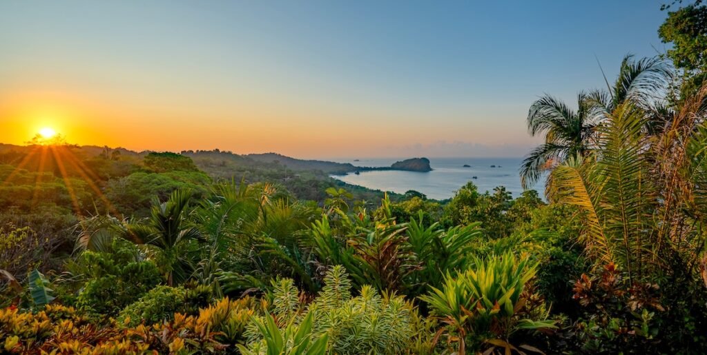 Vibrant sunrise over the wild untamed coastal beauty of Manuel Antonio National Park on the Pacific Coast of Costa Rica.