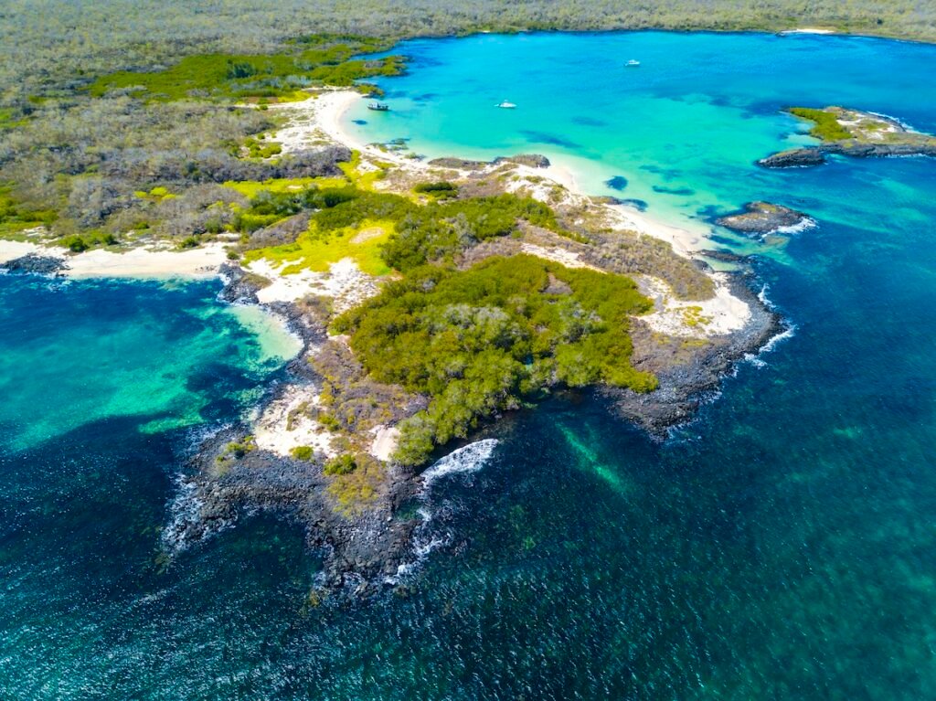 Aerial view of the sandy Cerro Brujo Beach at the north western coast of San Cristobal Island, Galapagos, Ecuador.