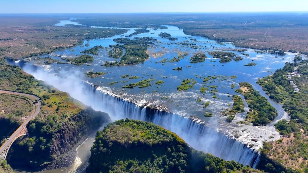 Victoria Falls At Livingstone In Northern Rhodesia Zambia. Nature Waterfall. Zambezi River Landscape. Livingstone At Northern Rhodesia Zambia. Southern Africa. Tourism Travel. 7 Natural Wonders
