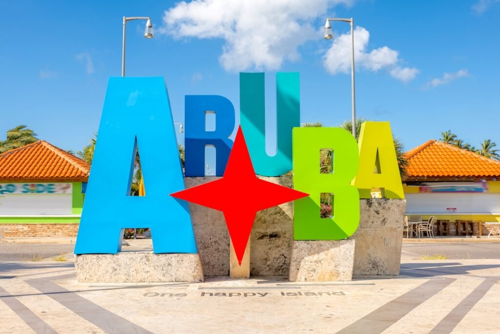 Colorful Aruba sign with a star, perfect for tourism. Bright letters attract visitors. Ideal for travel promotions and Caribbean destination showcases.