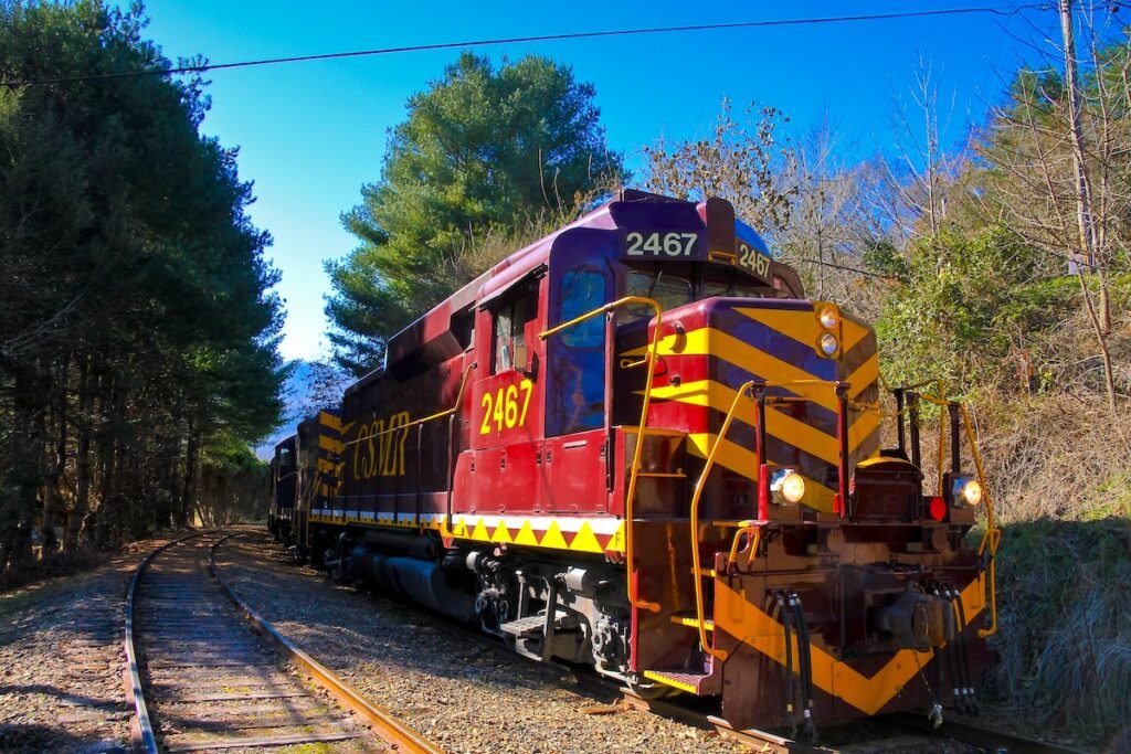 Bryson City, NC, USA - Taken this picture at south of Smoky Mountain National Park in USA in Bryson City of the main locomotive of Mountain Railway standing at the station. Great Smoky Mountain Railroad is very famous for the joy rides for tourists; captured the complete trail once it is stationary at platform.