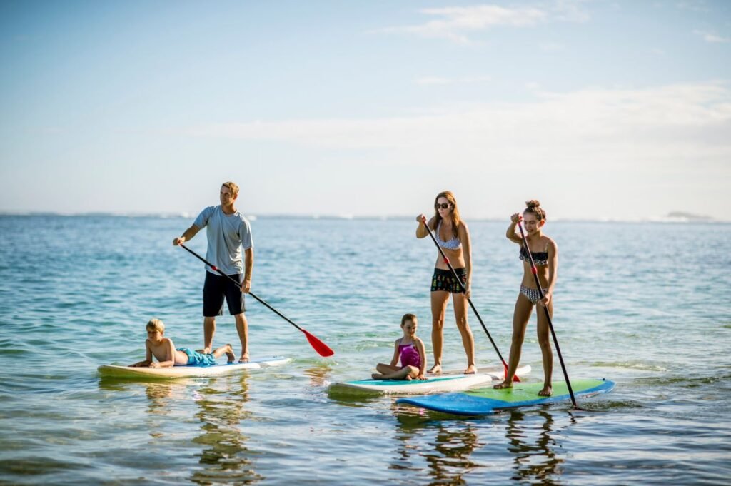 family paddleboarding kirpal hawaii wellness retreat Wellness Retreats,retreat,budget family wellness retreats