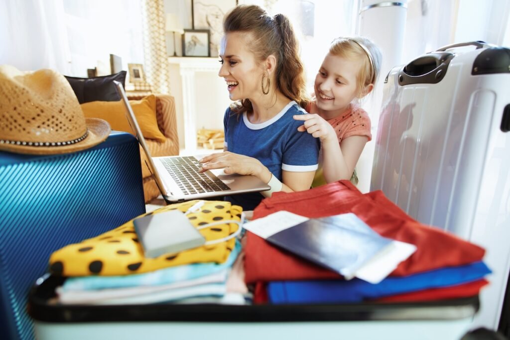 mom daughter laptop flight deal packing home Travel Tuesday,Travel Tuesday flight deals for families